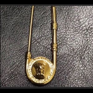 Decorative gold Medusa safety pin